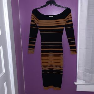 Light fit weight Pattern. Brown and Black Dress. Comes down to your knees